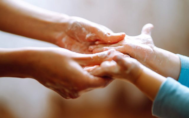 Illustrative. A mother helps her child wash hands. For 20 seconds, of course. (iStock)