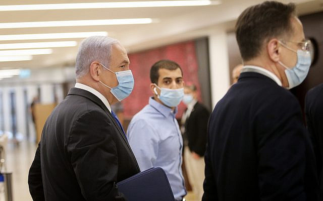 Prime Minister Benjamin Netanyahu walks in the Knesset after presenting the 35th government of Israel to the Knesset, May 17, 2020. (Alex Kolomoisky/POOL) Prime Minister Benjamin Netanyahu walks in the Knesset after presenting the 35th government of Israel to the Knesset, May 17, 2020. (Alex Kolomoisky/POOL)