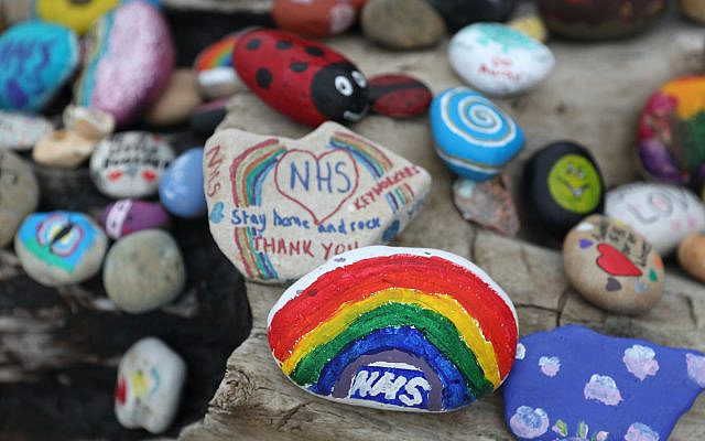 Painted pebbles showing support for the NHS and keyworkers, and containing positive messages, which have been left by members of the public on Avon beach in Christchurch, as the UK continues in lockdown to help curb the spread of the coronavirus. (Jewish News)
