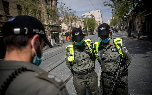 Israelis wearing protective masks due to the COVID-19 pandemic e.  Photo by: JINIPIX via Jewish News