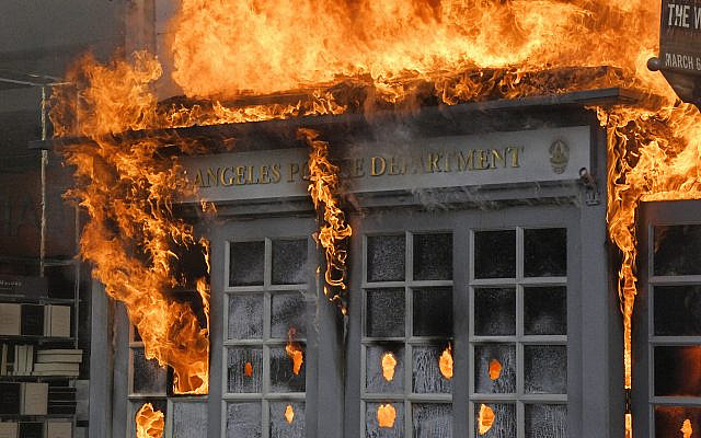 A Los Angeles Police Department kiosk is seen ablaze in The Grove shopping center during a protest over the death of George Floyd, Saturday, May 30, 2020, in Los Angeles. Protests were held in U.S. cities over the death of Floyd, a black man who died after being restrained by Minneapolis police officers on May 25. (AP Photo/Mark J. Terrill) A Los Angeles Police Department kiosk is seen ablaze in The Grove shopping center during a protest over the death of George Floyd, Saturday, May 30, 2020, in Los Angeles. Protests were held in U.S. cities over the death of Floyd, a black man who died after being restrained by Minneapolis police officers on May 25. (AP Photo/Mark J. Terrill)