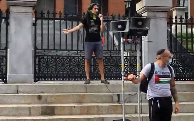 An organizer from BDS Boston tells the crowd at a Day of Rage rally in Boston why they are there. 'This is the Day of Rage,' he says. 'This is the day even more of Palestine is going to be annexed after it had already been annexed in 1967 and in 1948. This is just another layer and a more visible layer and we’re not going to put up with it.' (Dexter Van Zile)