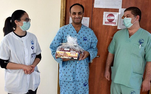 Johnny, the bus driver from East Jerusalem who recovered from the coronavirus, is released from hospital, March 30, 2020. More than two months later, after being discharged from the hospital, Johnny's health is still deeply affected. 'He can't work, he can't walk. He walks two minutes and he gets tired,' his father told Channel 12. (Maya Tzaben/Baruch Padeh Medical Center) Johnny, the bus driver from East Jerusalem who recovered from the coronavirus, is released from hospital, March 30, 2020. More than two months later, after being discharged from the hospital, Johnny's health is still deeply affected. 'He can't work, he can't walk. He walks two minutes and he gets tired,' his father told Channel 12. (Maya Tzaben/Baruch Padeh Medical Center)