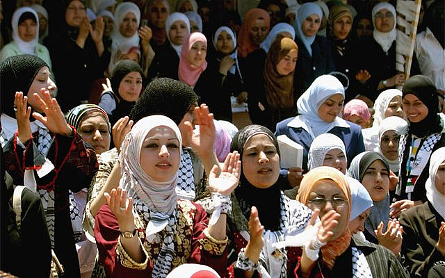 Palestinian student Fatah movement supporters celebrate their victory in the student elections at Al-Quds Open University in the West Bank city of Jenin May 3, 2006. REUTERS/Mohamad Torokman