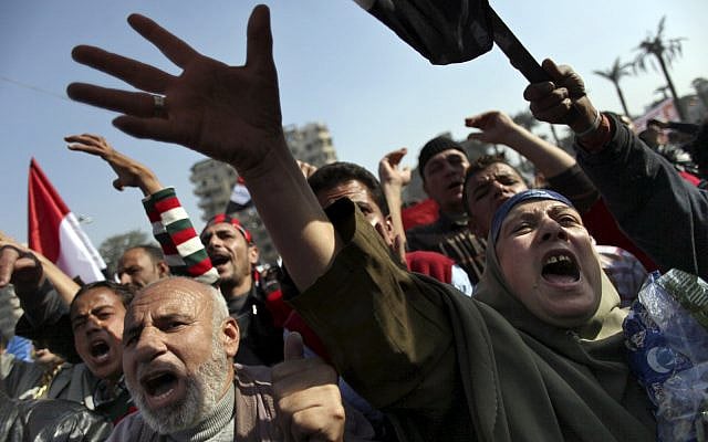 Egyptians protesters chant anti-Muslim Brotherhood slogans at a rally in Tahrir Square, in Cairo, Egypt, Friday, Nov. 30, 2012. (AP Photo/Khalil Hamra)