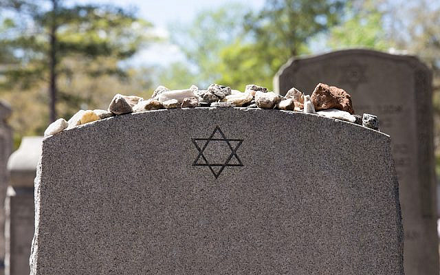 Headstone in a Jewish cemetery with Star of David and memory stones. (iStock) Headstone in a Jewish cemetery with Star of David and memory stones. (iStock)