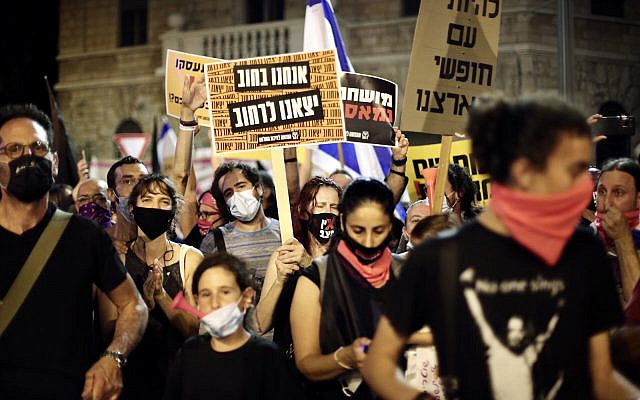 Demonstrators protest the government's mismanagement of the fight against COVID-19 and demand the resignation of Prime Minister Benjamin Netanyahu in front of his Jerusalem residence, Aug. 29, 2020. (Mostafa Alkharouf/Anadolu Agency via Getty Images)