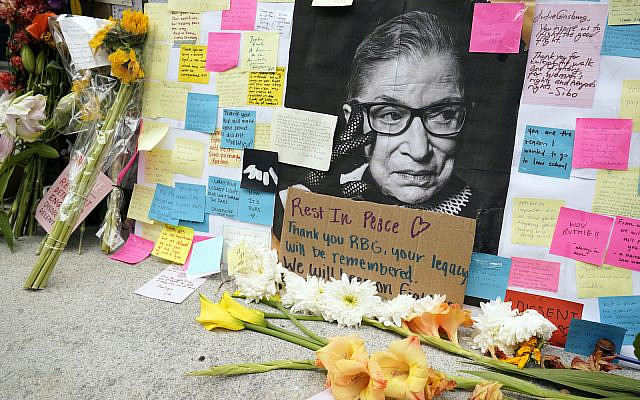 A memorial to US Supreme Court Justice Ruth Bader Ginsburg, outside the Harvard Law School library at Langdell Hall, on the campus of Harvard University, in Cambridge, Mass. Sept. 22, 2020 (AP Photo/Steven Senne)