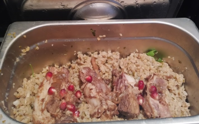 The remainders of the author's kosher goat meat lunch extravaganza (Moroccan-spiced goat meat on freekeh with pomegranates). Photo: Author