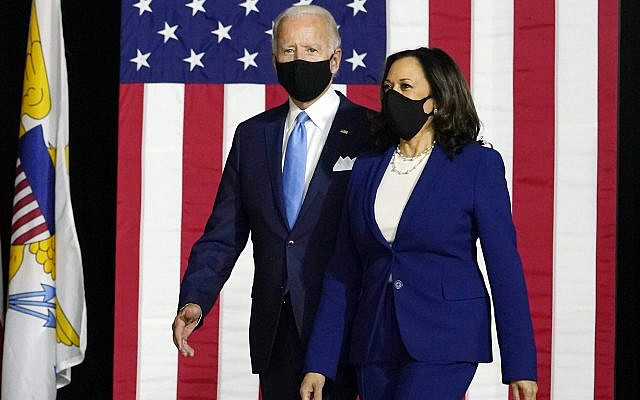 Democratic presidential candidate former Vice President Joe Biden and his running mate Sen. Kamala Harris, D-Calif., arrive to speak at a news conference at Alexis Dupont High School in Wilmington, Del., Wednesday, Aug. 12, 2020. (AP Photo/Carolyn Kaster)