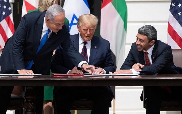 Prime Minister Benjamin Netanyahu (L), US President Donald Trump, and UAE Foreign Minister Abdullah bin Zayed Al-Nahyan(R)smile as they participate in the signing of the Abraham Accords where the countries of Bahrain and the United Arab Emirates recognize Israel, at the White House in Washington, DC, September 15, 2020. (SAUL LOEB / AFP) Prime Minister Benjamin Netanyahu (L), US President Donald Trump, and UAE Foreign Minister Abdullah bin Zayed Al-Nahyan(R)smile as they participate in the signing of the Abraham Accords where the countries of Bahrain and the United Arab Emirates recognize Israel, at the White House in Washington, DC, September 15, 2020. (SAUL LOEB / AFP)