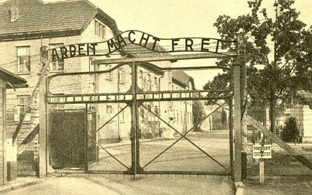 The main gate to Auschwitz. (The Folklore Research Center, Hebrew University of Jerusalem; available via the National Library of Israel Digital Collection: St. Mucha, Publisher: State Museum in Auschwitz) The main gate to Auschwitz. (The Folklore Research Center, Hebrew University of Jerusalem; available via the National Library of Israel Digital Collection: St. Mucha, Publisher: State Museum in Auschwitz)