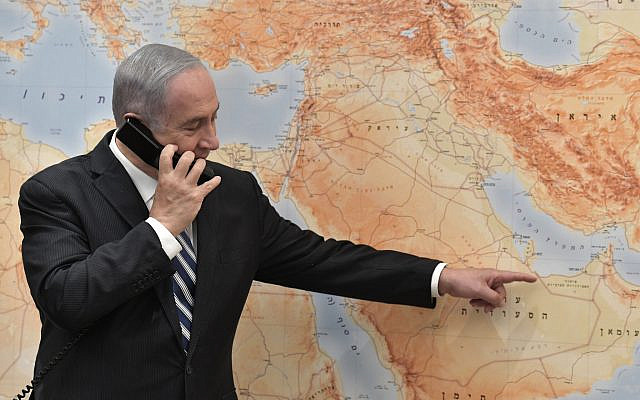 Israeli Prime Minister Benjamin Netanyahu pointing on a map as he speaks to flight LY971 Captain Tal Becker upon the plane's landing in Abu Dhabi, United Arab Emirates, (Photo by: KOBI GIDEON- GPO Via JINIPIX via Jewish News)