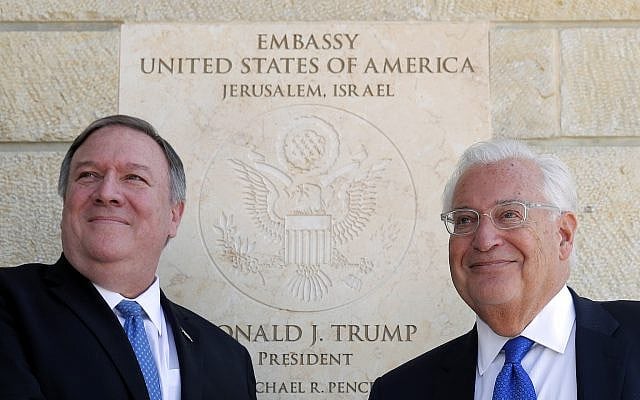 US Secretary of State Mike Pompeo, left, and US ambassador to Israel David Friedman stand next to the dedication plaque at the US Embassy in Jerusalem on March 21, 2019. (Jim Young/Pool/AFP)