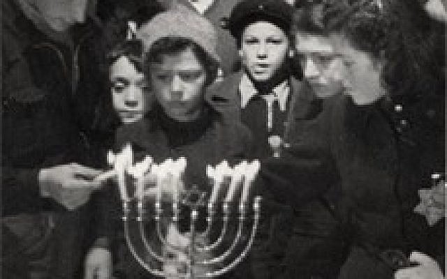 Hanukkah candle lighting ceremony in the Westerbork Transit Camp, Netherlands, 1943. (From Yad Vashem Archives)