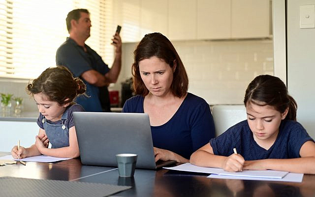 Family at home as the pandemic coronavirus (COVID-19) forces many employees and students to work and study from home. Real people. Copy space