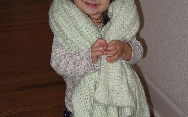 A friend enjoying her knitted blanket