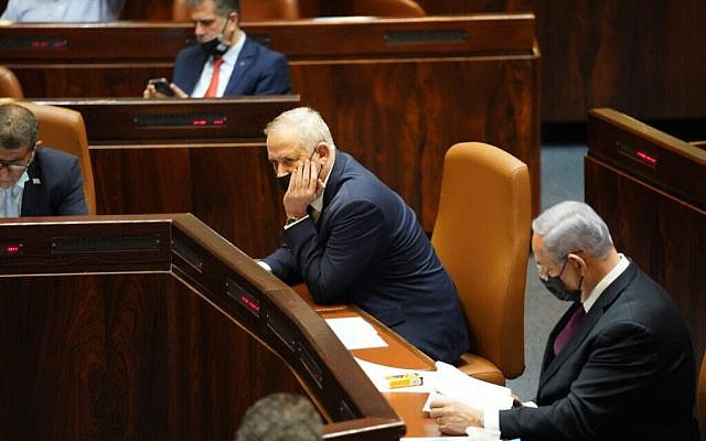 Benny Gantz, left, and Benjamin Netanyahu in the Knesset during a vote for the parliament to dissolve itself, on December 2, 2020. (Danny Shem Tov/ Knesset Spokesperson) Benny Gantz, left, and Benjamin Netanyahu in the Knesset during a vote for the parliament to dissolve itself, on December 2, 2020. (Danny Shem Tov/ Knesset Spokesperson)