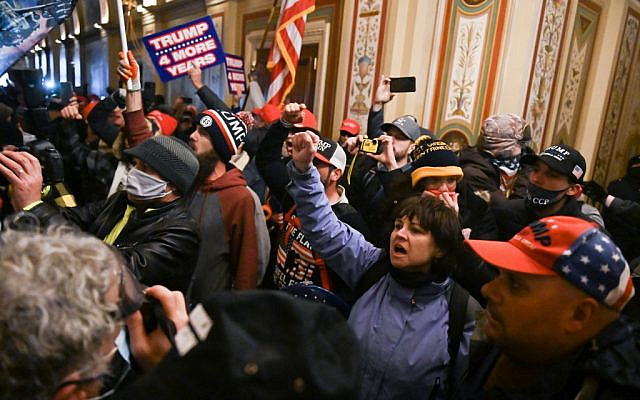 Supporters of US President Donald Trump protest inside the US Capitol on January 6, 2021, in Washington, DC. - Demonstrators breeched security and entered the Capitol as Congress debated the a 2020 presidential election Electoral Vote Certification. (Photo by ROBERTO SCHMIDT / AFP) Supporters of US President Donald Trump protest inside the US Capitol on January 6, 2021, in Washington, DC. - Demonstrators breeched security and entered the Capitol as Congress debated the a 2020 presidential election Electoral Vote Certification. (Photo by ROBERTO SCHMIDT / AFP)
