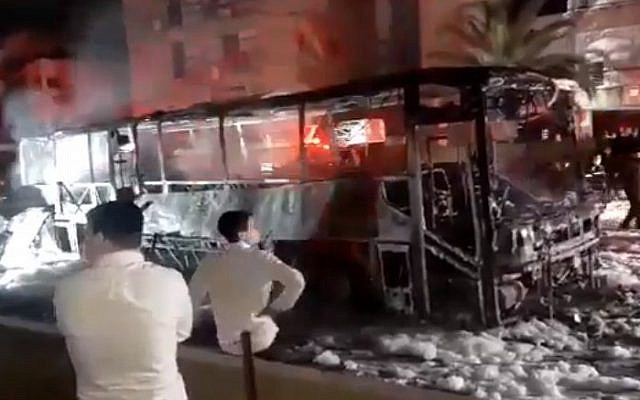 Ultra-Orthodox protesters set a bus on fire during a protest against the enforcement of the coronavirus lockdown, in the city of Bnei Brak, January 25, 2021. (Screen capture/ Twitter) Ultra-Orthodox protesters set a bus on fire during a protest against the enforcement of the coronavirus lockdown, in the city of Bnei Brak, January 25, 2021. (Screen capture/ Twitter)