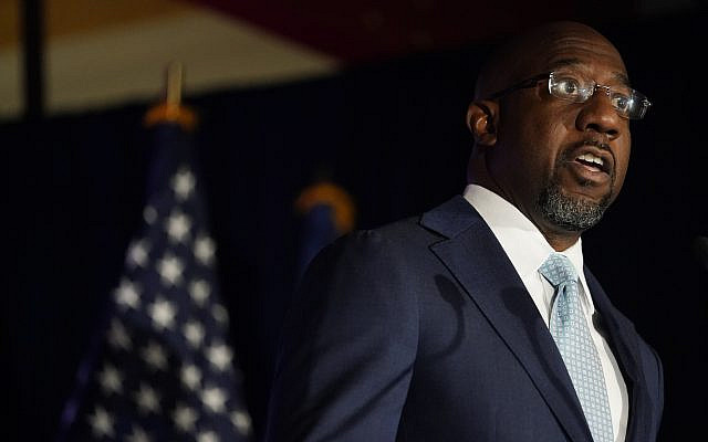 Raphael Warnock, a Democratic candidate for the US Senate speaks during a rally, November 3, 2020, in Atlanta. (AP Photo/ Brynn Anderson, Pool) Raphael Warnock, a Democratic candidate for the US Senate speaks during a rally, November 3, 2020, in Atlanta. (AP Photo/ Brynn Anderson, Pool)