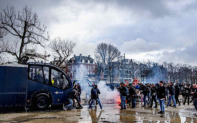 Hundreds of protestors not wearing face masks clash with Dutch riot police at an illegal protest against the Netherlands' new lockdown measures in Museumplein on January 17, 2021 in Amsterdam, Netherlands. Photo by Robin Utrecht/ABACAPRESS.COMNo Use Germany. No Use Netherlands.