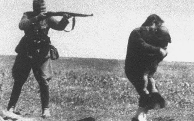 The Ivanhorod Einsatzgruppen photograph is an image of the Holocaust, showing a soldier aiming a rifle at a woman who is trying to shield a child with her body. It depicts the murder of Jews by an Einsatzgruppen death squad near Ivanhorod, Ukraine, in 1942. The photograph was mailed, intercepted by the Polish resistance in Warsaw, and kept by Jerzy Tomaszewski. In the 1960s, it was alleged that the image was a Communist forgery, but that claim was debunked. Since then, the photograph has been frequently used in books, museums, and exhibitions relating to the Holocaust. Photograph historian Janina Struk describes it as "a symbol of the barbarity of the Nazi regime and their industrial scale murder of 6 million European Jews."[1]