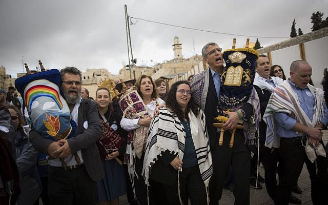In this Nov. 2, 2016 photo, the heads of the Reform and Conservative movements carry Torah scrolls as they march to the Western Wall. (AP Photo/Sebastian Scheiner, File)