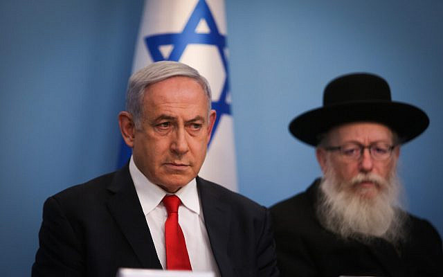 Prime Minister Benjamin Netanyahu (L) and Health Minister Yaakov Litzman during a press conference about the coronavirus at the Prime Ministers Office in Jerusalem on March 8, 2020. (Yonatan Sindel/Flash90)