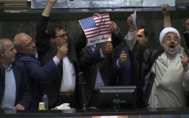 Iranian politicians burning US flag (picture from Times of Israel)