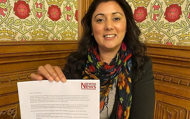 Nus Ghani holding the Uyghur petition signed by 150 Parliamentarians (Jewish News)