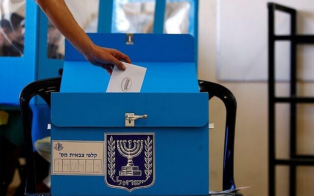 An Israeli soldier casts his early vote in the March 23 general election, amid the coronavirus disease (COVID-19) crisis, at a mobile polling station at a military base, near Kibbutz Regavim, Israel March 17, 2021. REUTERS/Corinna Kern. Via Jewish News