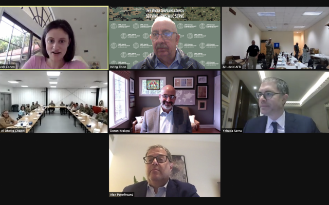 JWB Jewish Chaplains Council® Zoom Seder for AGJC, March 2021. Right to Left, Top to Bottom: #1: Sarah Cohen, Executive Director of AGJC; #2 Rabbi Irving A. Elson, CAPT, USN (Ret)| Vice-President, Director, JWB Jewish Chaplains Council; #3: (walking off screen) Dan Wise, JWB Jewish Lay Leader, Seder at Al Dhafra Air Base in Abu Dhabi; #4: Al Udeid Air Force Base outside of Doha, Qatar; #5: Doron Krakow, president and CEO, JCC Association of North America; #6: Rabbi Yehuda Sarna, honorary chairman of AGJC; #7: Alex Peterfreund, Hazan for UAE and AGJC Board member. (courtesy)