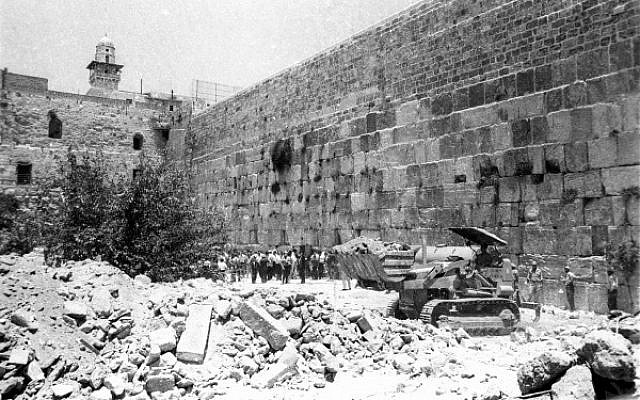 Bulldozers clear the rubble of houses nearest to the Western Wall, June 11, 1967. (From the collection of Dan Hadani, National Library of Israel/Times of Israel).