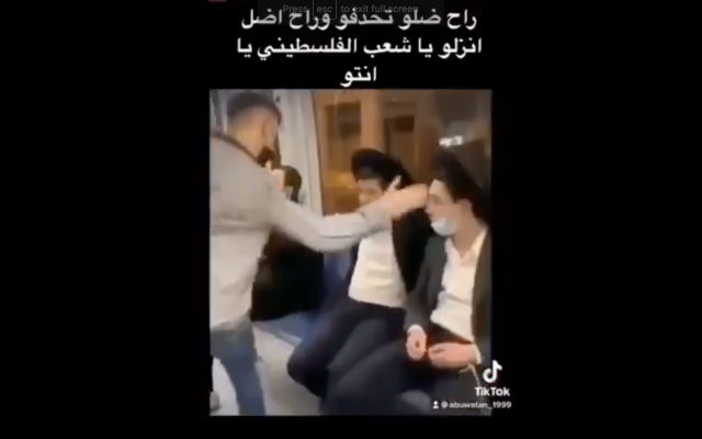 Screen capture from a TikTok a video of a Palestinian teen slapping Jewish passengers on the Jerusalem light rail train, April 15, 2021 Screen capture from a TikTok a video of a Palestinian teen slapping Jewish passengers on the Jerusalem light rail train, April 15, 2021