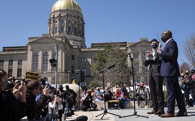 US Sens. Jon Ossoff, D-Ga., and Raphael Warnock, D-Ga., speak during a 'stop Asian hate' rally outside the Georgia State Capitol in Atlanta on March 20, 2021. (AP Photo/ Ben Gray)