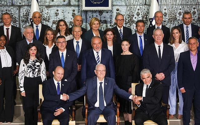 Ministers in the newly sworn in Israeli government pose for a group photo at the president's residence in Jerusalem. June 14, 2021. (Yonatan Sindel/FLASH90)
