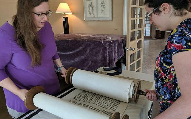 Leaders at the 2019 JOFA Shabbaton prepare the Torah scroll on Friday for Shabbat morning services. (courtesy) Leaders at the 2019 JOFA Shabbaton prepare the Torah scroll on Friday for Shabbat morning services. (courtesy)