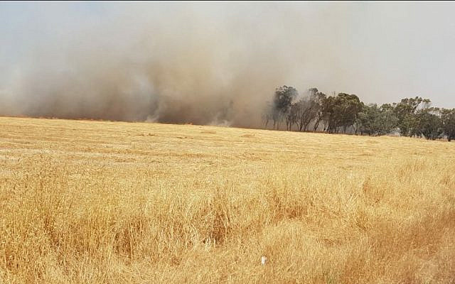 Land in southern Israel, near the Gaza border, burns possibly as a result of incendiary balloons sent from Gaza on May 7, 2021. (Moshe Baruchi/KKL-JNF/courtesy) Land in southern Israel, near the Gaza border, burns possibly as a result of incendiary balloons sent from Gaza on May 7, 2021. (Moshe Baruchi/KKL-JNF/courtesy)