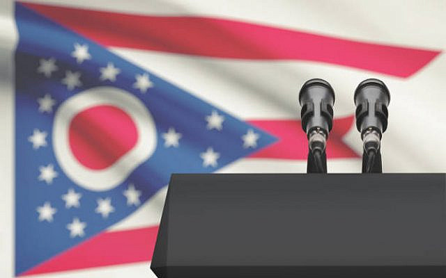 Pulpit and two microphones with US state flag on background - Ohio