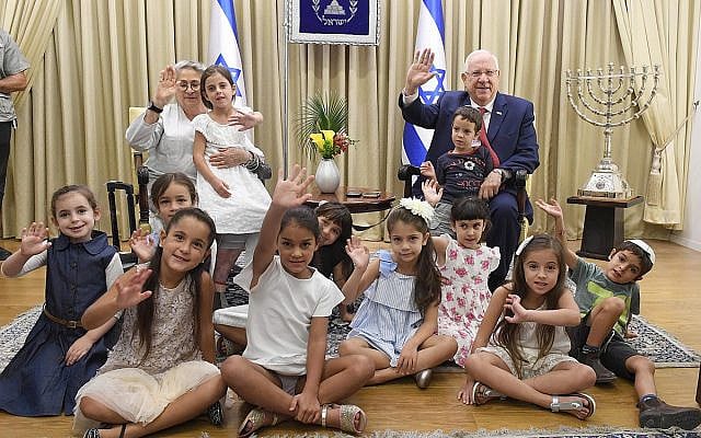 President of Israel Reuven Rivlin, and his wife host children who are entering first grade, towards the start of the school year, at the President's Residence, on August 31, 2017. (Mark Neyman / GPO)