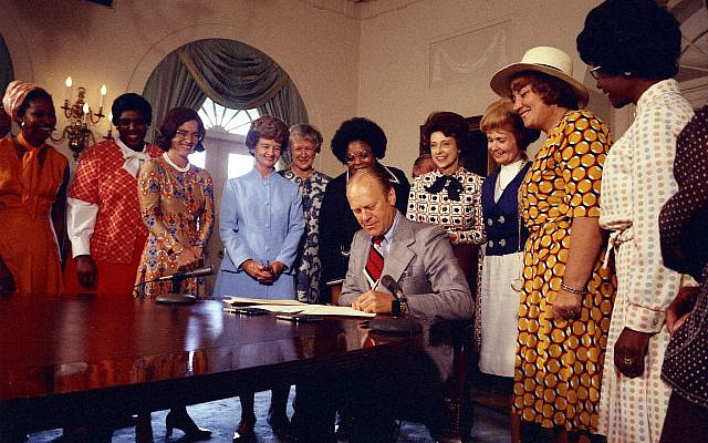 President Gerald R. Ford Signing the Proclamation on Women's Equality Day 1974 in the Cabinet Room. Bella Abzug (D-New York) stands second from right, beside Shirley Chisholm (D-New York) on right. (CC-PD via Wikipedia)