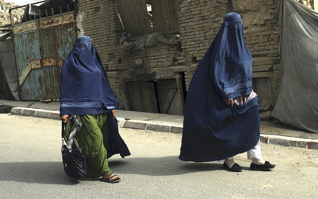 Afghan women in burqas walk on a street in Kabul, Afghanistan, Sunday, Aug. 22, 2021. (AP/Rahmat Gul)