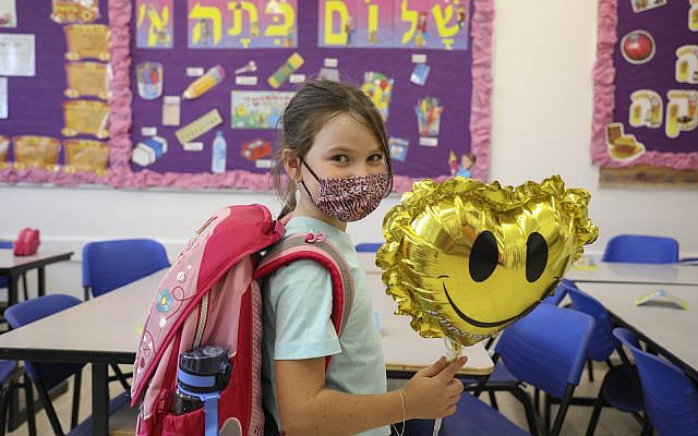 Students arrive to the classroom ahead of the opening of the school, at Orot Etzion School, in Efrat in the West Bank on August 30, 2021. (Gershon Elinson/Flash90)