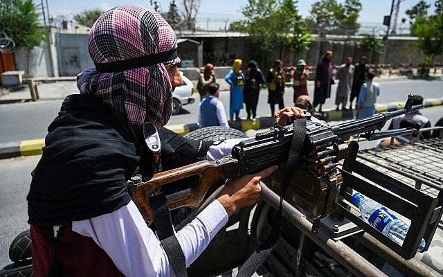 A Taliban fighter mans a machinegun on top of a vehicle as they patrol along a street in Kabul on August 16, 2021, after a stunningly swift end to Afghanistan's 20-year war, as thousands of people mobbed the city's airport trying to flee the group's feared hardline brand of Islamist rule. (Wakil Kohsar / AFP) A Taliban fighter mans a machinegun on top of a vehicle as they patrol along a street in Kabul on August 16, 2021, after a stunningly swift end to Afghanistan's 20-year war, as thousands of people mobbed the city's airport trying to flee the group's feared hardline brand of Islamist rule. (Wakil Kohsar / AFP)