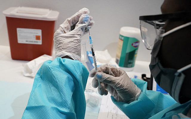 FILE - In this July 22, 2021, file photo, health care worker fills a syringe with the Pfizer COVID-19 vaccine at the American Museum of Natural History in New York. U.S. health officials Wednesday, Aug. 18, recommended all Americans get COVID-19 booster shots to shore up their protection amid the surging delta variant and evidence that the vaccines' effectiveness is falling. (AP Photo/Mary Altaffer, File) FILE - In this July 22, 2021, file photo, health care worker fills a syringe with the Pfizer COVID-19 vaccine at the American Museum of Natural History in New York. U.S. health officials Wednesday, Aug. 18, recommended all Americans get COVID-19 booster shots to shore up their protection amid the surging delta variant and evidence that the vaccines' effectiveness is falling. (AP Photo/Mary Altaffer, File)