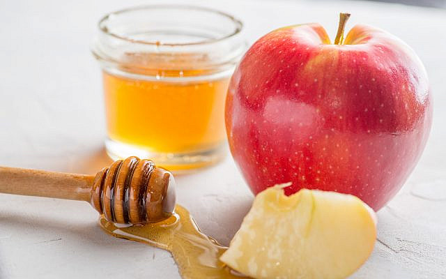 (apple and honey image via iStock)