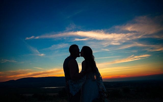 Silhouette of a couple at sunset. (iStock)