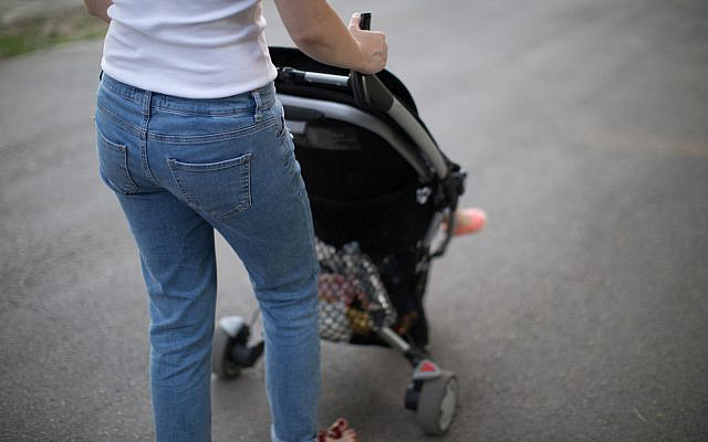 (Woman pushing stroller image via iStock) (Woman pushing stroller image via iStock)