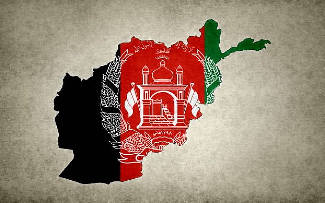 Grunge map of Afghanistan with its flag printed within its border on an old paper.